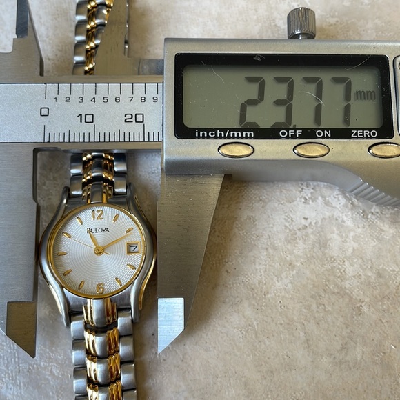 COPY - Bulova lady battery water resistant 30m silver and gold w/date main image 7